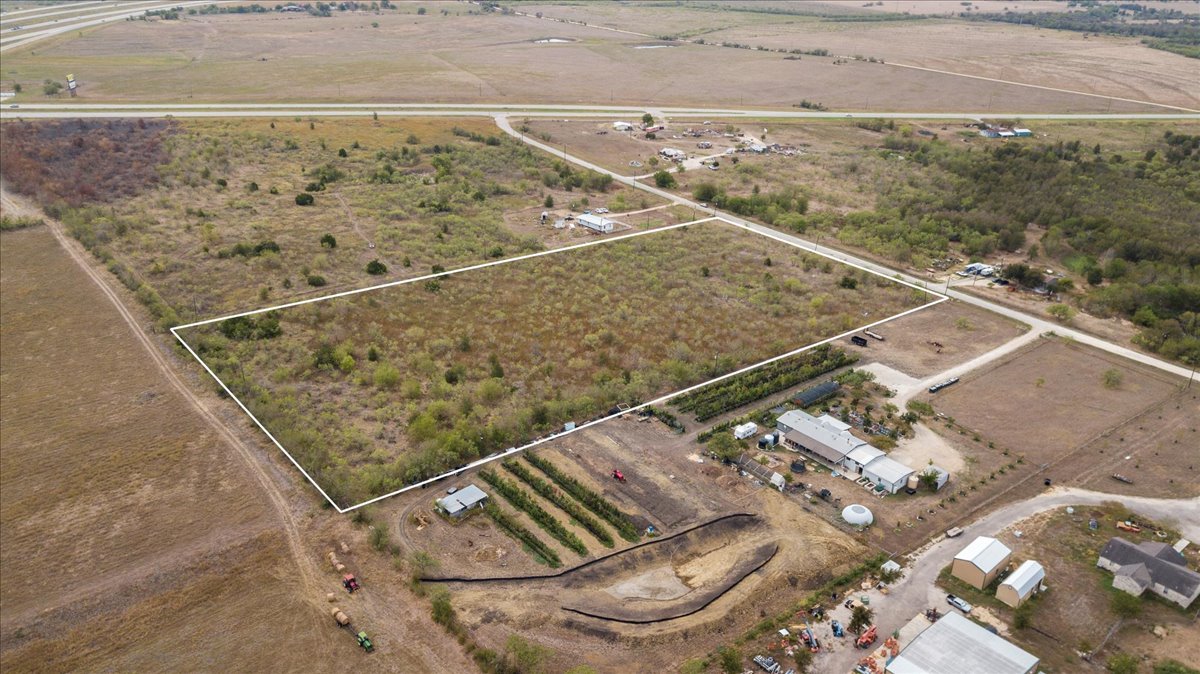 Tbd Ranchero Drive Buda, TX 78610 - Photo 4 of 10 Aerial view of sparsely populated area with property boundaries highlighted