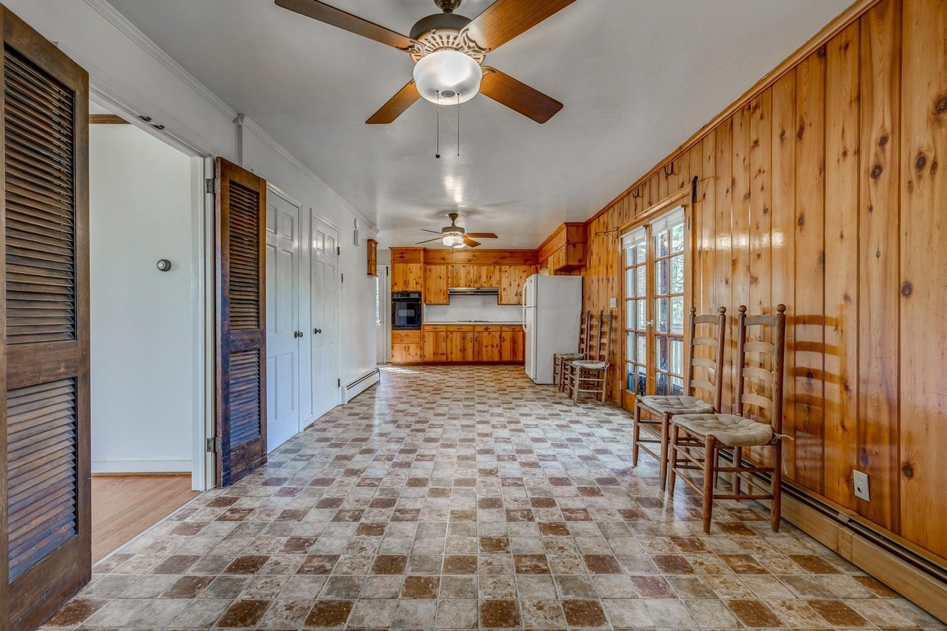5571 Highfields Road Roanoke, VA 24018 - Photo 11 of 45 a very nice looking room with a large window and chandelier