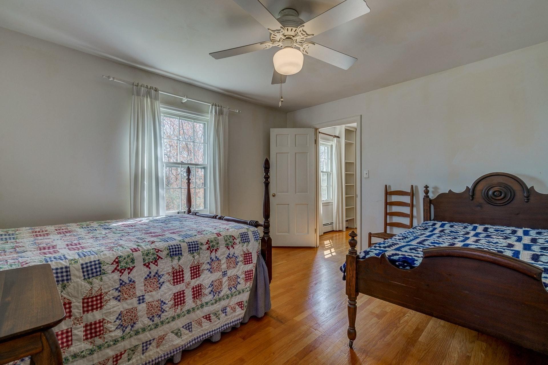 5571 Highfields Road Roanoke, VA 24018 - Photo 17 of 45 a bedroom with a bed and wooden floor