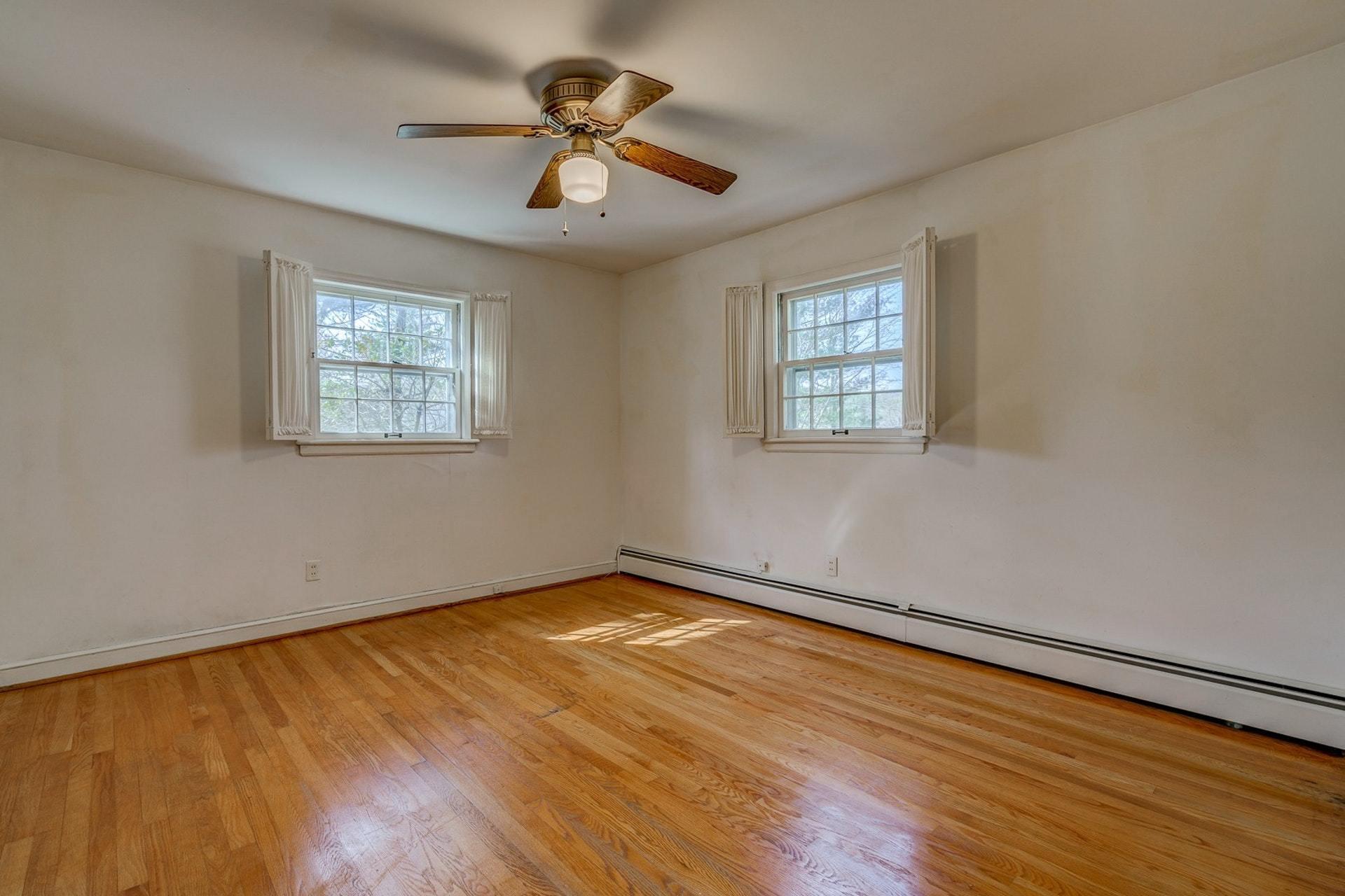 5571 Highfields Road Roanoke, VA 24018 - Photo 19 of 45 a view of an empty room with a window and wooden floor