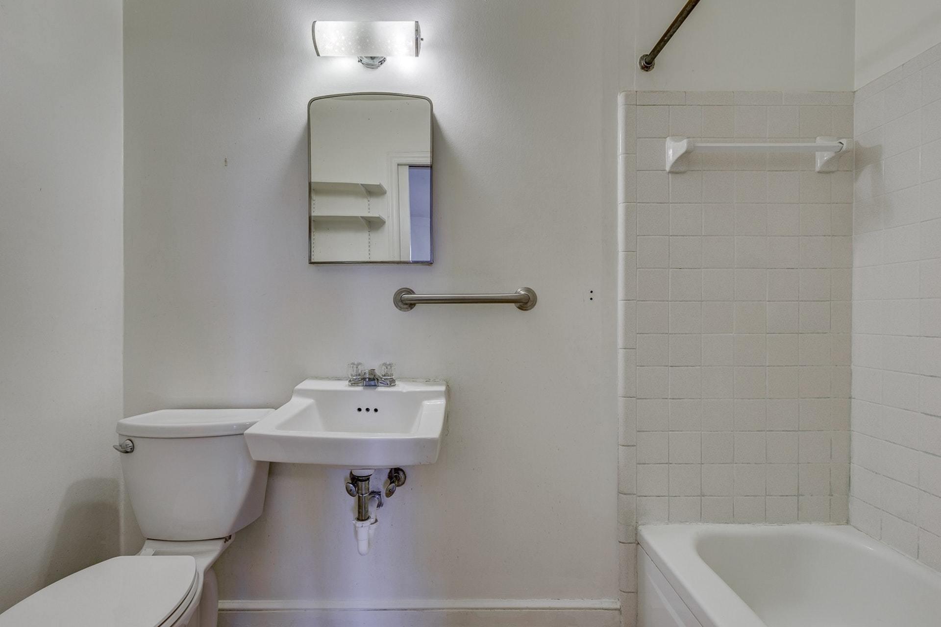 5571 Highfields Road Roanoke, VA 24018 - Photo 21 of 45 a bathroom with a sink a mirror and a toilet