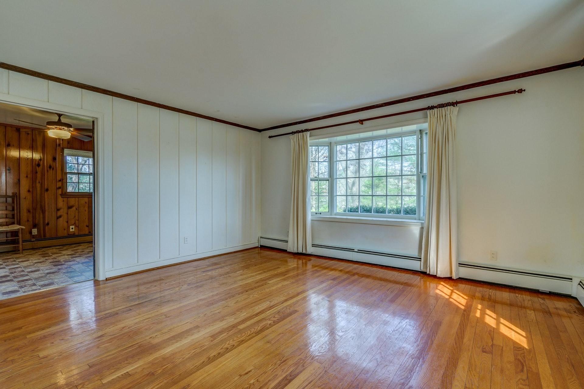 5571 Highfields Road Roanoke, VA 24018 - Photo 4 of 45 a view of an empty room with wooden floor and a window