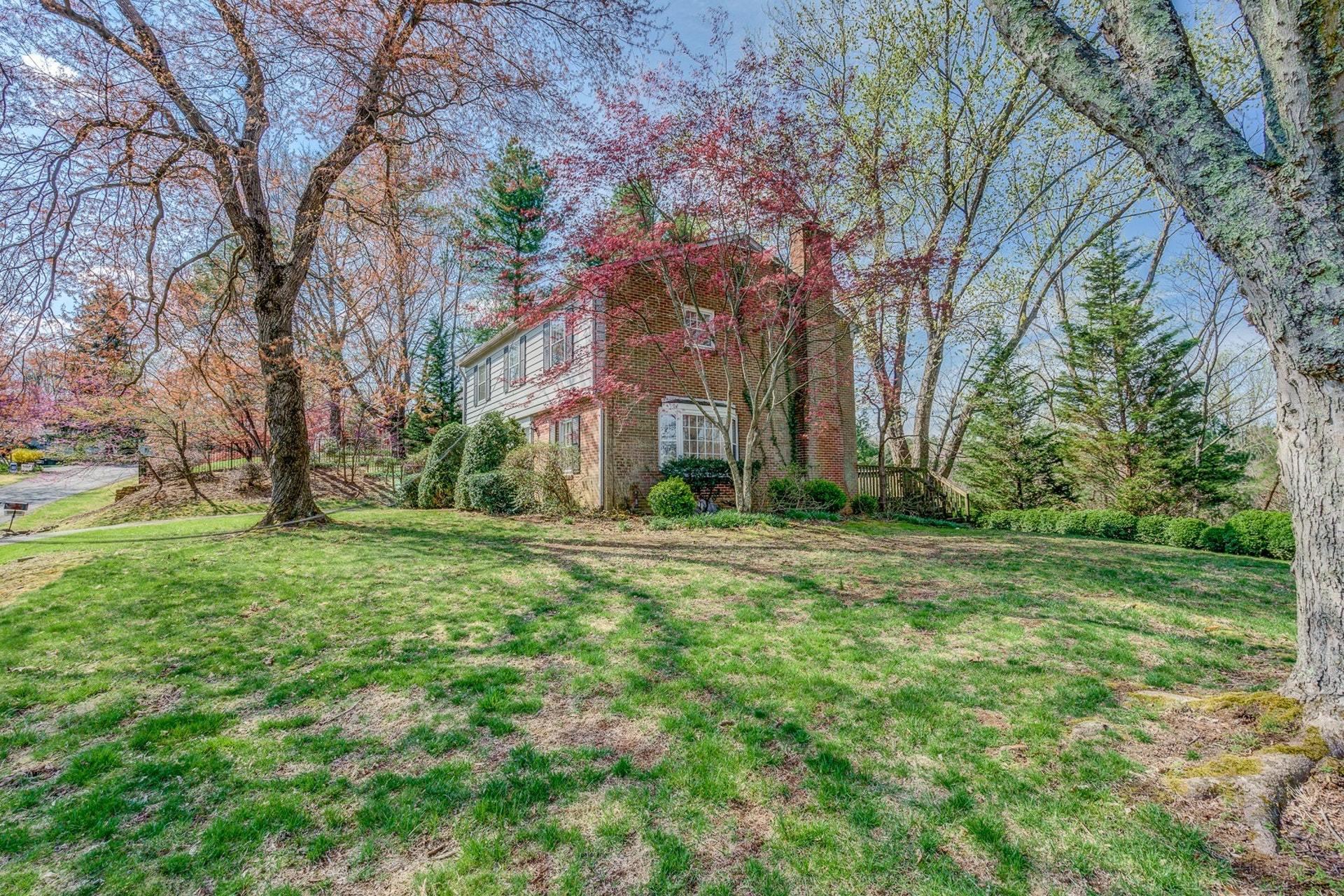 5571 Highfields Road Roanoke, VA 24018 - Photo 34 of 45 a view of a backyard with large trees