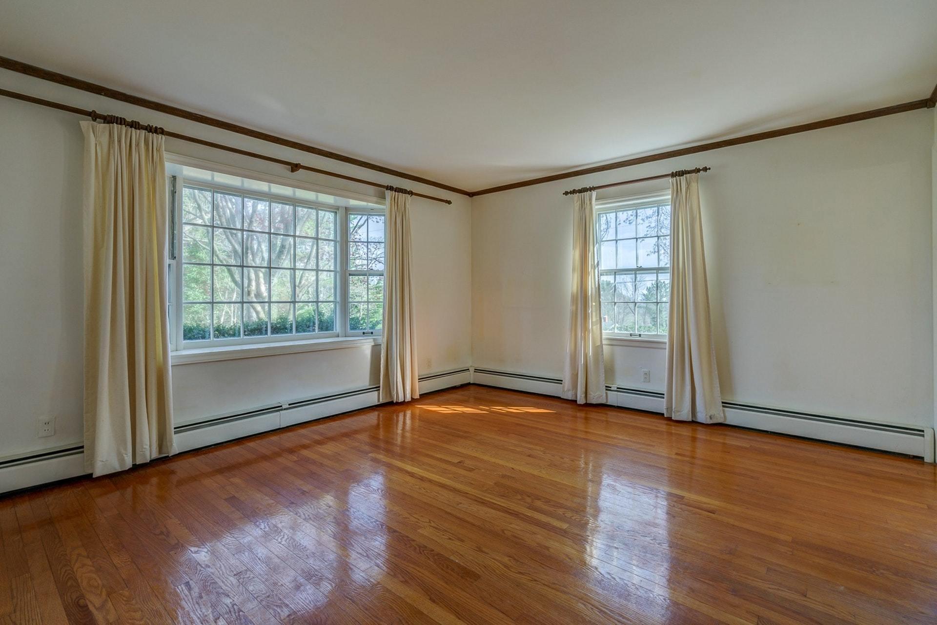 5571 Highfields Road Roanoke, VA 24018 - Photo 5 of 45 an empty room with wooden floor and windows