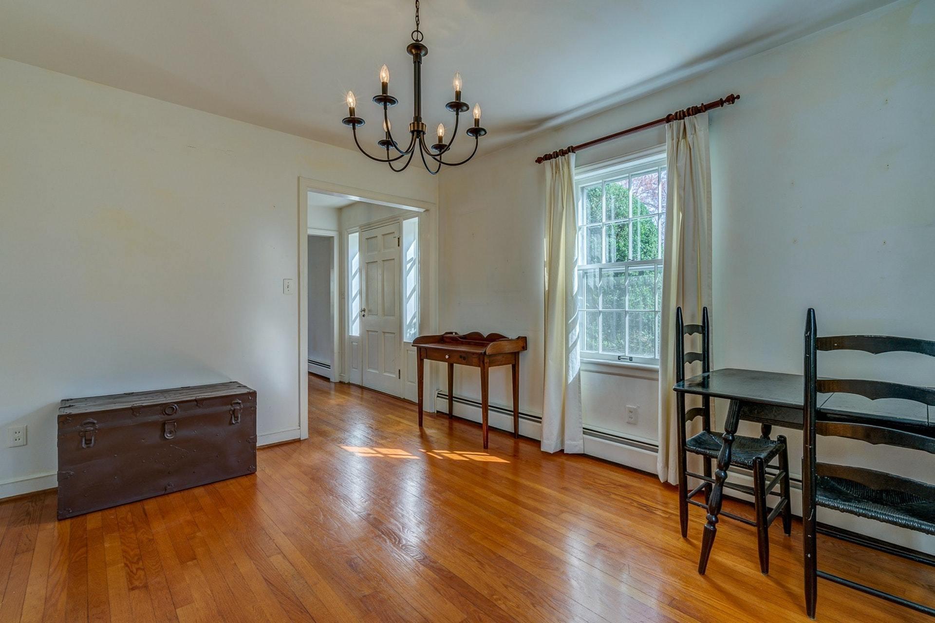 5571 Highfields Road Roanoke, VA 24018 - Photo 6 of 45 a living room with furniture and a chandelier