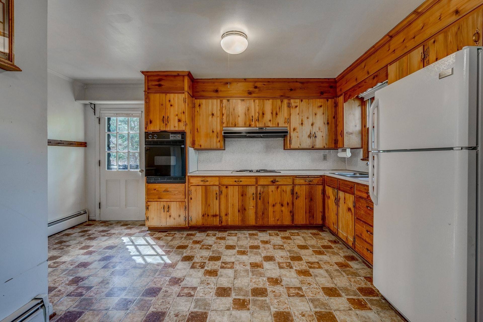 5571 Highfields Road Roanoke, VA 24018 - Photo 9 of 45 a kitchen with a refrigerator and a sink