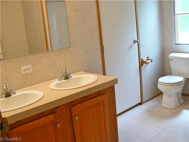 216 Nance Road Denton, NC 27239 - Photo 11 of 16 Other Bath. The Spacious Hall Bath is 7 x 10 . It opens to the Hall and to the Laundry. Laundry door in picture.