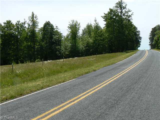 216 Nance Road Denton, NC 27239 - Photo 16 of 16 Land/Lot. Property has 349 feet of road frontage. This taken looking up the frontage. The drive is on left out of sight beyond the trees. All 4.2 gentle rolling acres are very usable. Often sought and seldom found.
