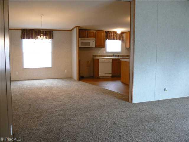 216 Nance Road Denton, NC 27239 - Photo 3 of 16 Interior Space/Layout. This was taken from just inside the front door. Living room to right. Dining room straight ahead. Public water from Handy Santitary and has a conventional septic system.