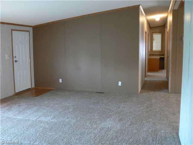 216 Nance Road Denton, NC 27239 - Photo 9 of 16 Interior Space/Layout. Taken from Master Bedroom looking across Living Room into Hall. Built in desk in distance. Den beyond.
