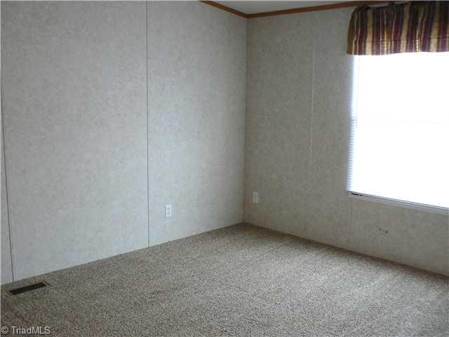 216 Nance Road Denton, NC 27239 - Photo 10 of 16 2nd Bedroom. There are 3 bedrooms off this hall. Two Bedrooms are 11 3" x 11 6" and the third one is 10 x 12 5".