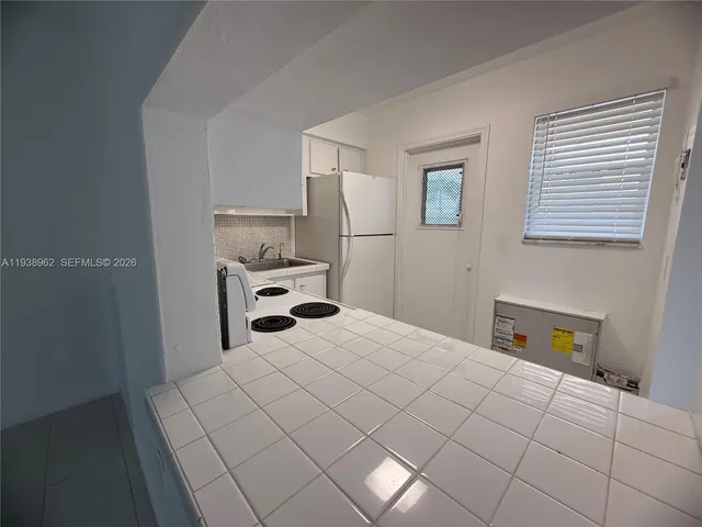 a bedroom with a bed and a cabinets