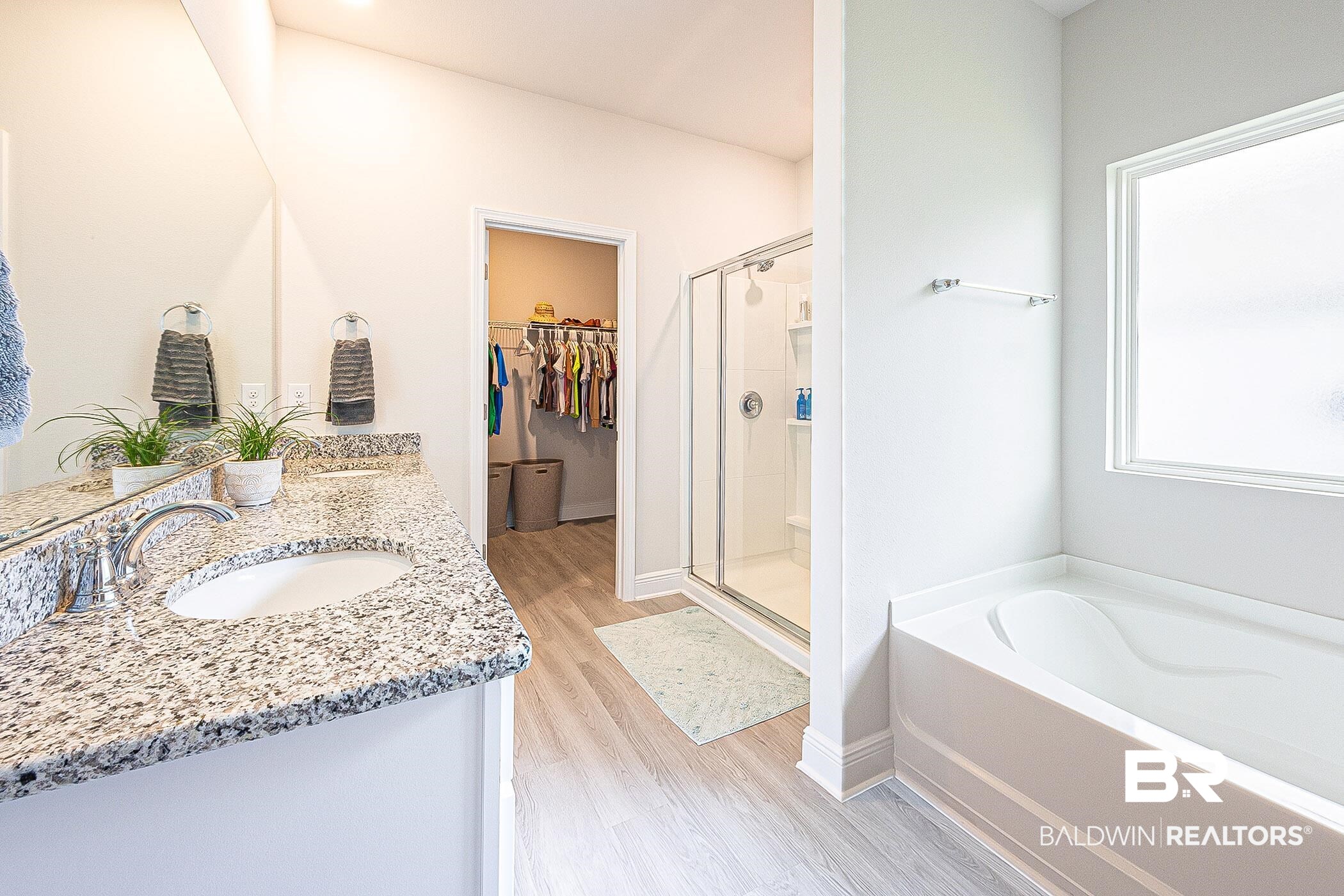 11044 Native Dancer Way Daphne, AL 36526 - Photo 19 of 67 Bathroom featuring double vanity, hardwood / wood-style flooring, and separate shower and tub