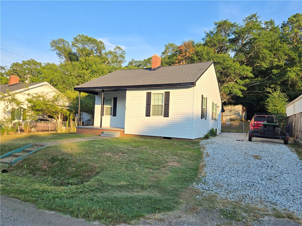28 Ames Street Seneca, SC 29678 - Photo 1 of 22 A classic ranch home features a covered front porch and a gravel driveway.