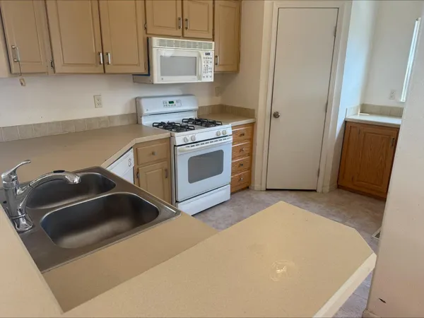 a kitchen with a stove and a sink