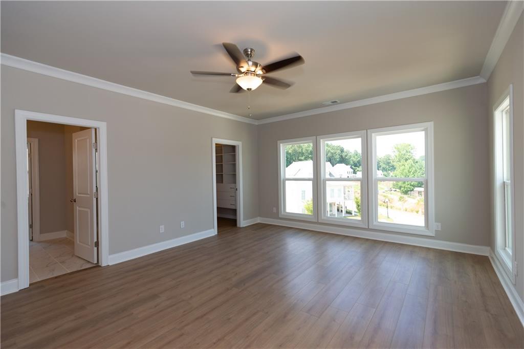 5590 Broad River View Peachtree Corners, GA 30092 - Photo 10 of 37 a view of an empty room with wooden floor and a window