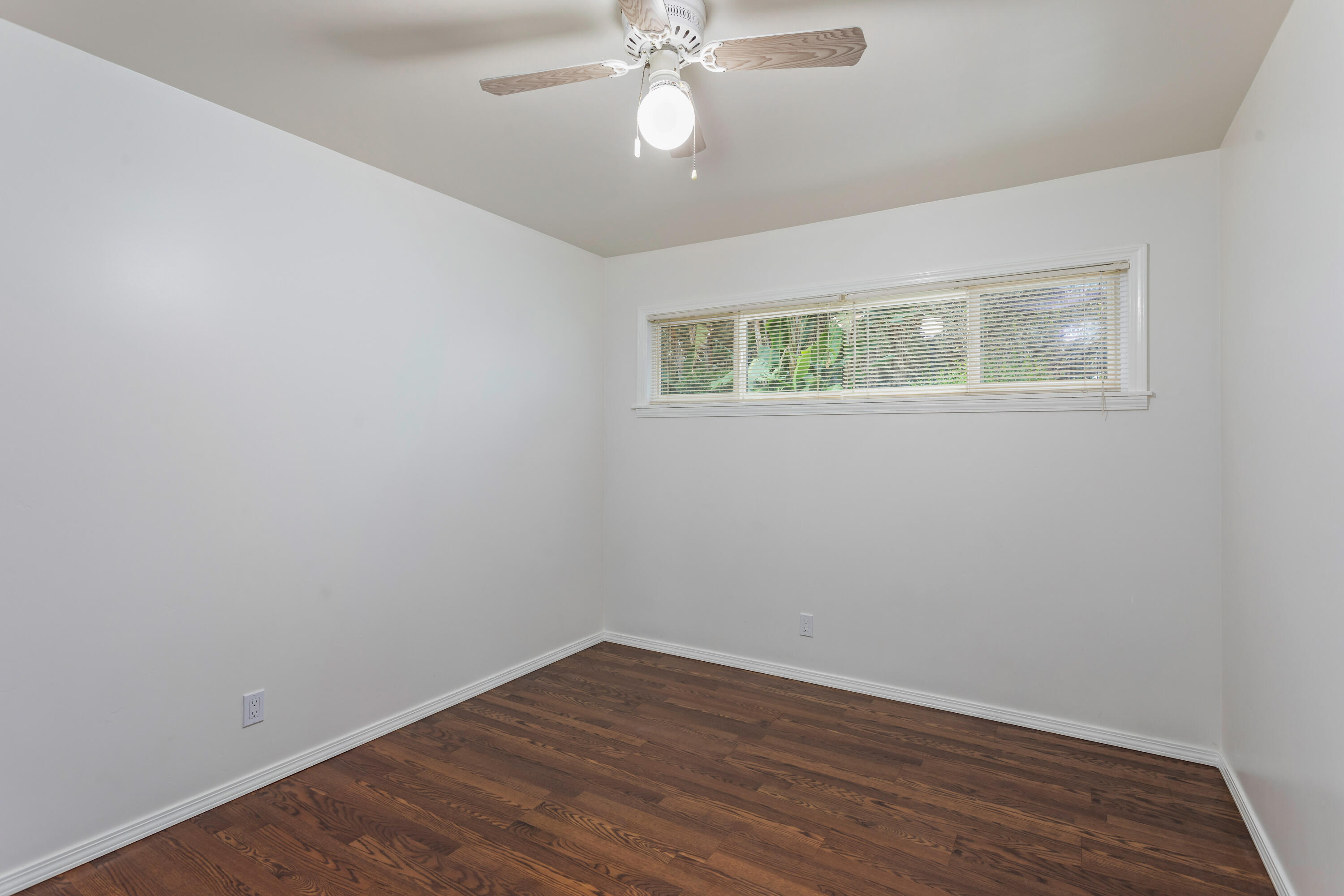 253 Pebble Beach Drive Goleta, CA 93117 - Photo 16 of 27 wooden floor in an empty room with a window