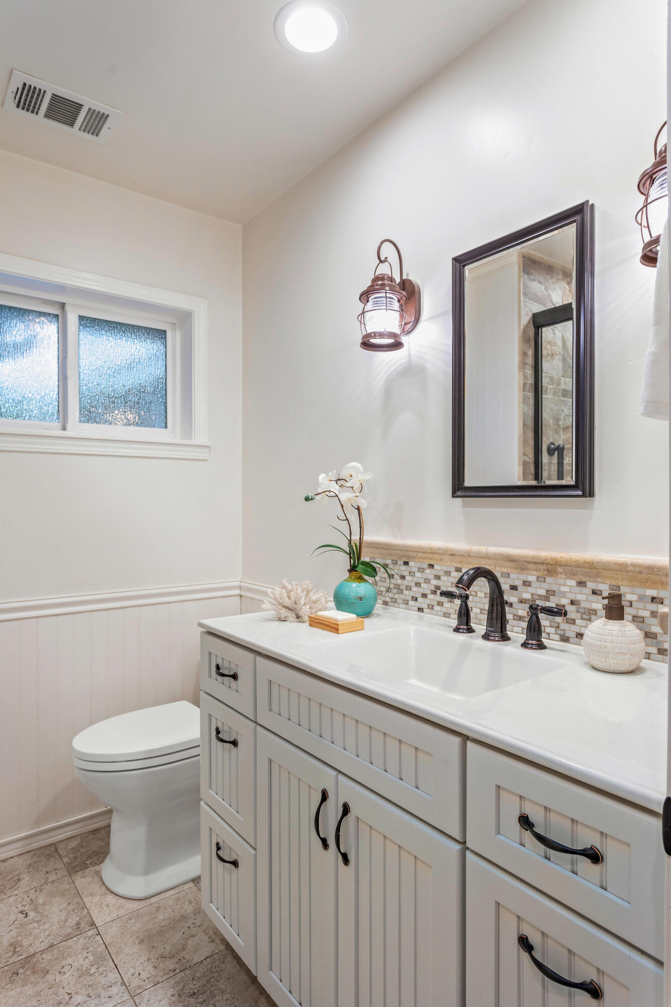 253 Pebble Beach Drive Goleta, CA 93117 - Photo 17 of 27 a bathroom with a toilet sink and mirror