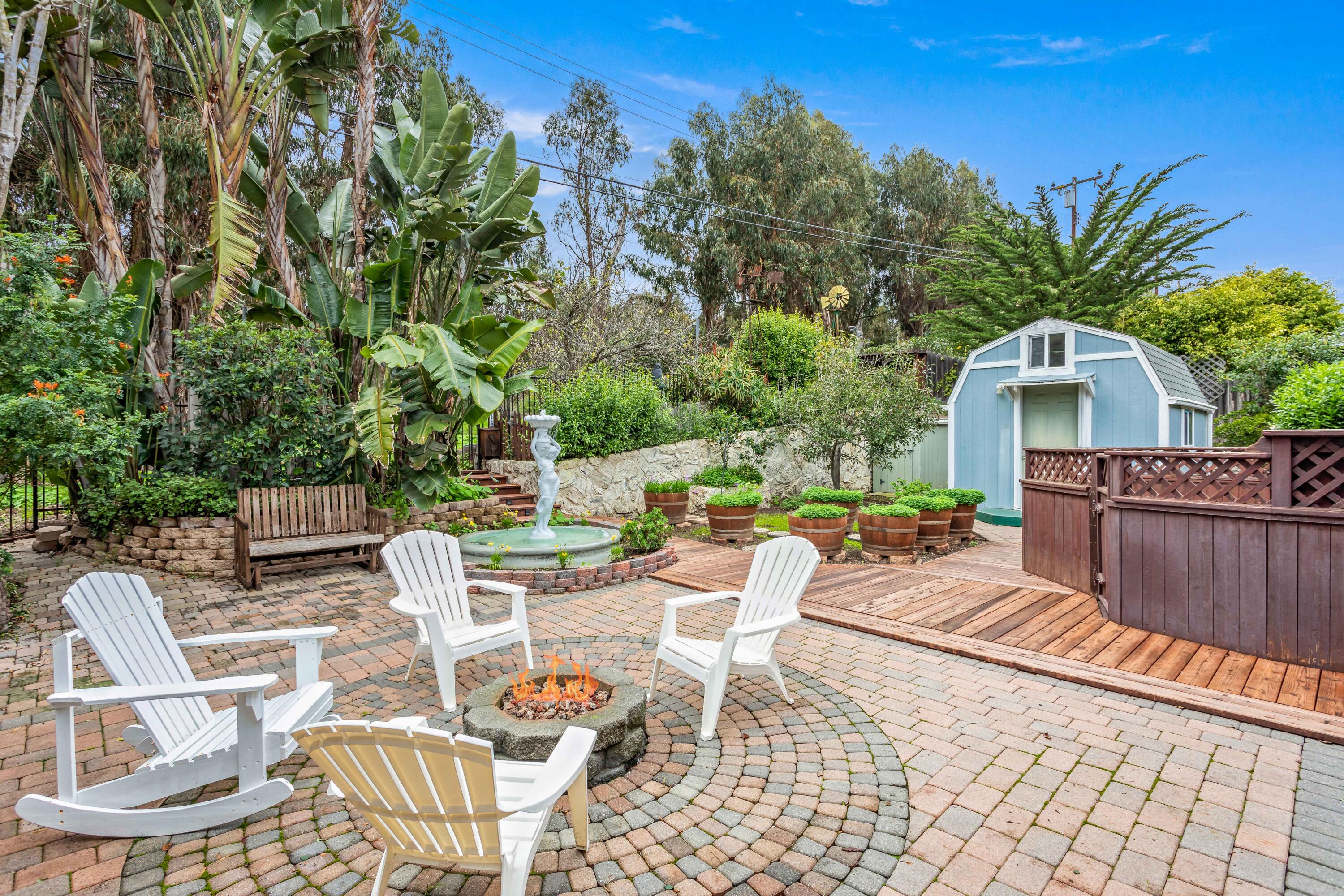 253 Pebble Beach Drive Goleta, CA 93117 - Photo 20 of 27 a view of a chairs and table in patio with a fire pit