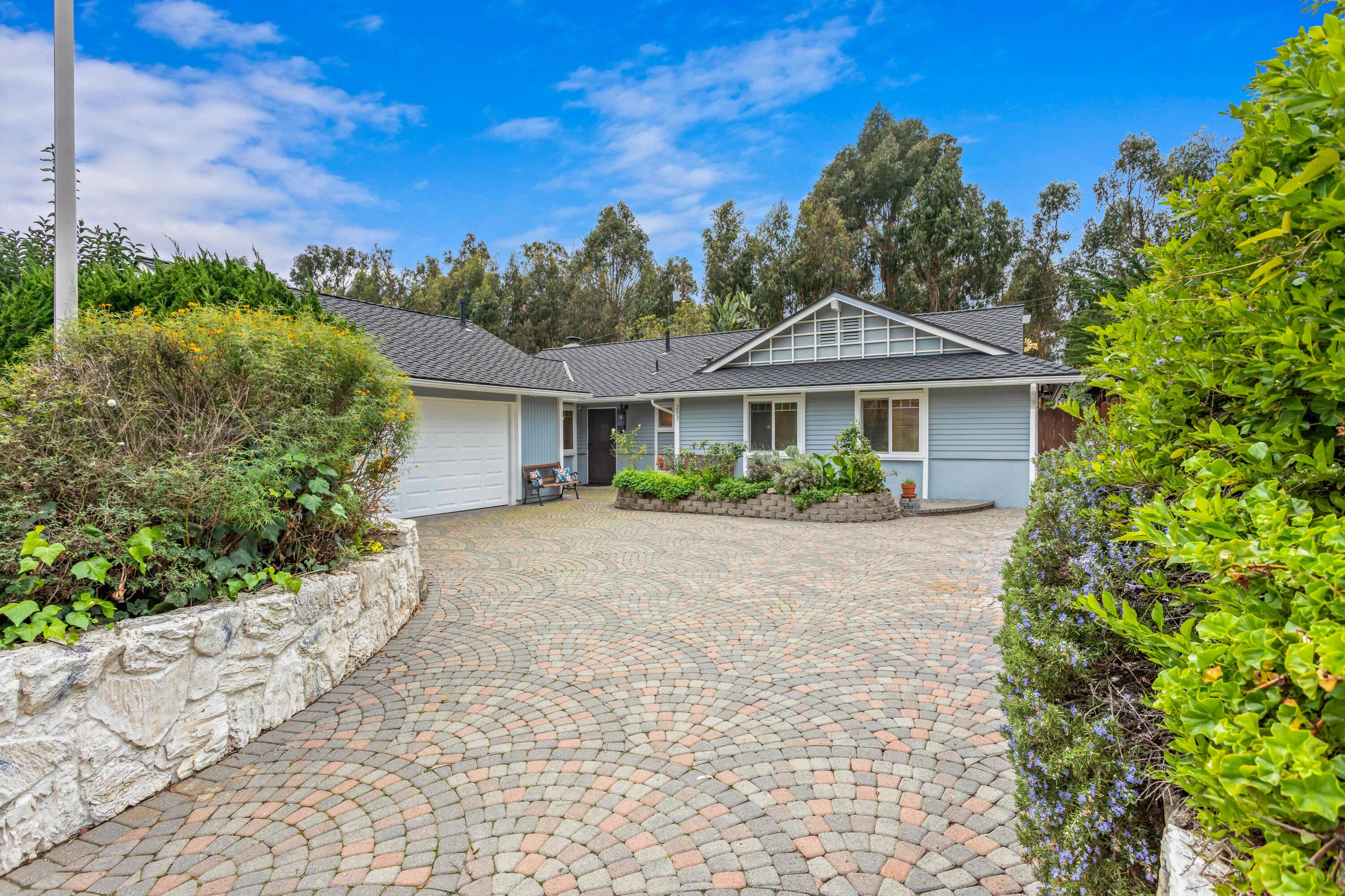 253 Pebble Beach Drive Goleta, CA 93117 - Photo 2 of 27 a front view of a house with a yard