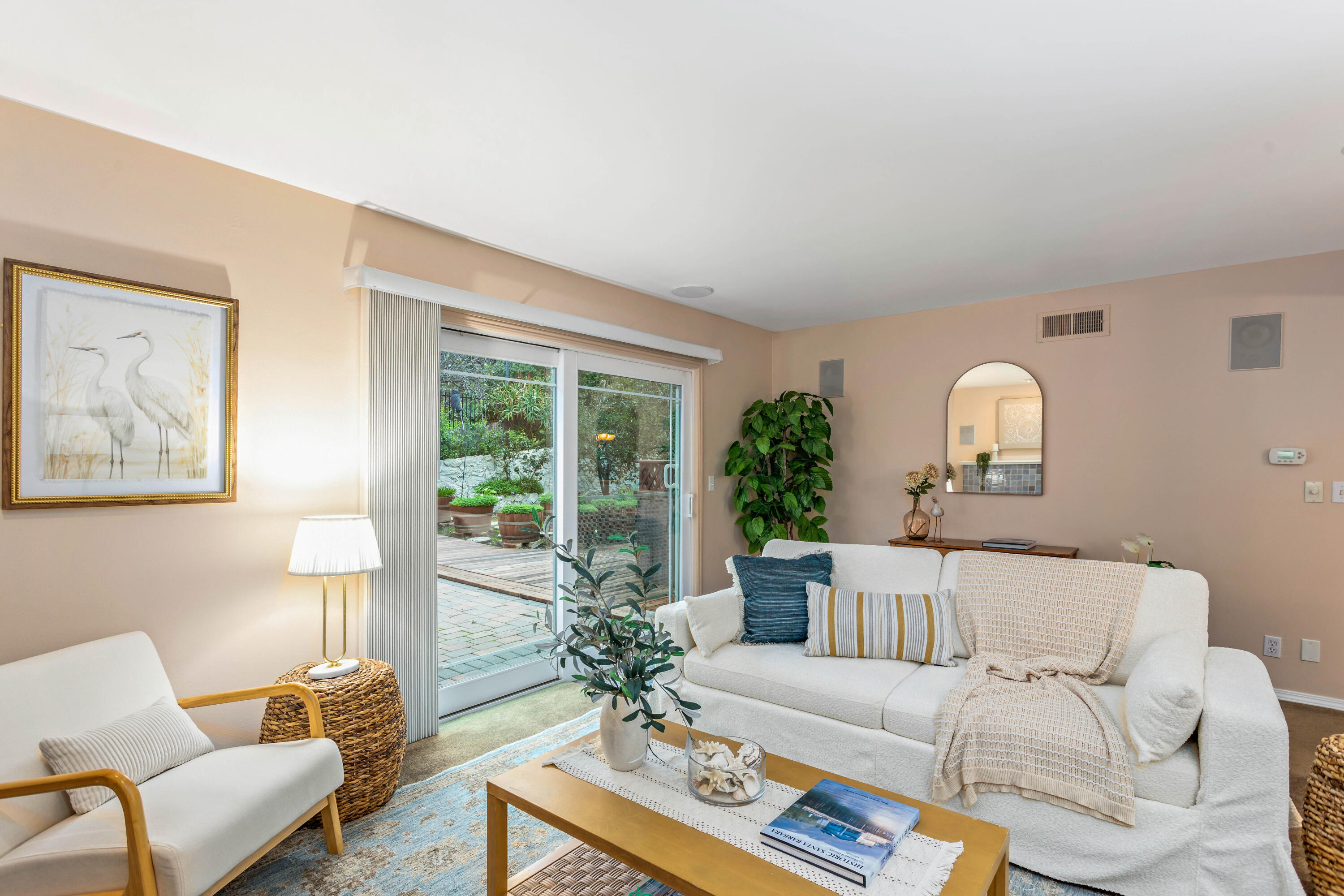 253 Pebble Beach Drive Goleta, CA 93117 - Photo 3 of 27 a living room with furniture and a potted plant