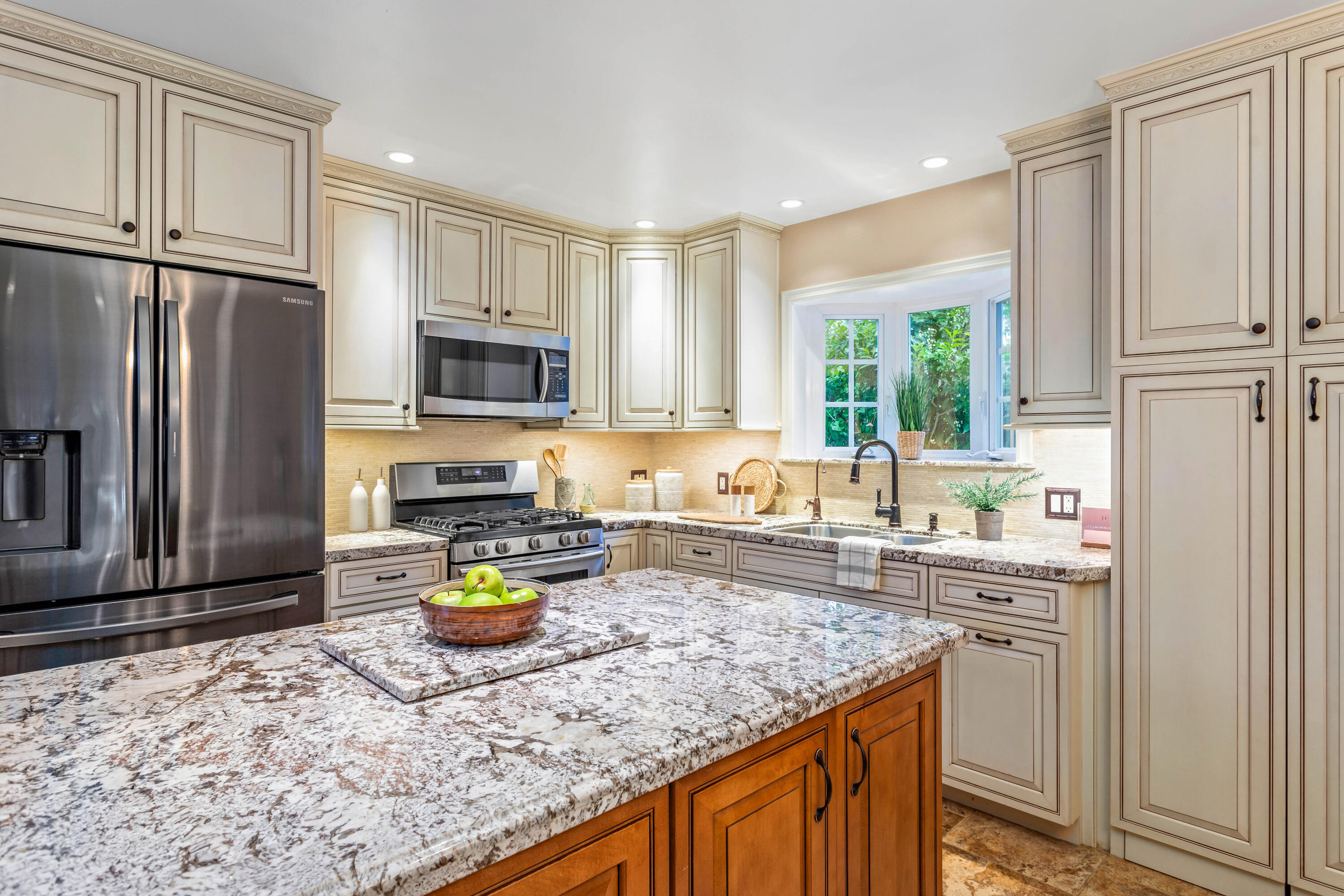 253 Pebble Beach Drive Goleta, CA 93117 - Photo 7 of 27 a kitchen with a refrigerator a stove a sink a counter space and cabinets