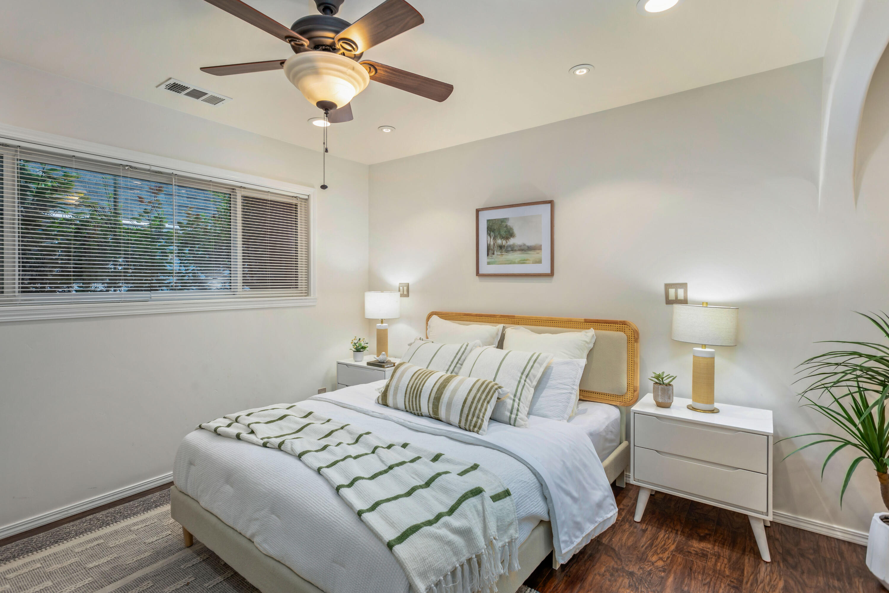 253 Pebble Beach Drive Goleta, CA 93117 - Photo 9 of 27 a bedroom with a bed and a chandelier