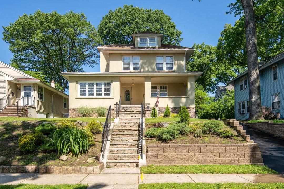 276 Sylvan Street Rutherford, NJ 07070 - Photo 1 of 1 front view of a house with a yard