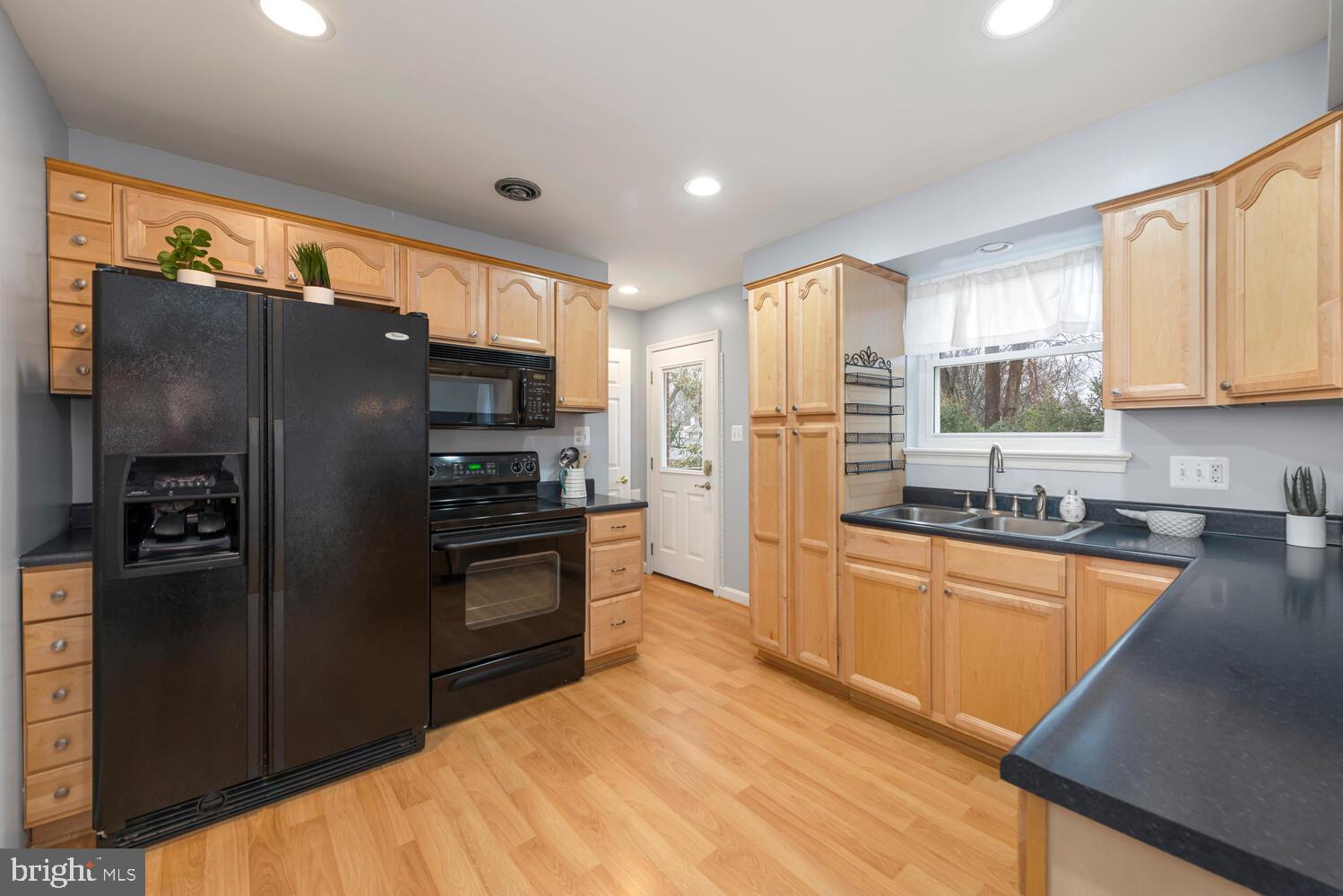 7405 Hallmark Place Springfield, VA 22150 - Photo 10 of 43 Bright, spacious kitchen with so many cabinets!