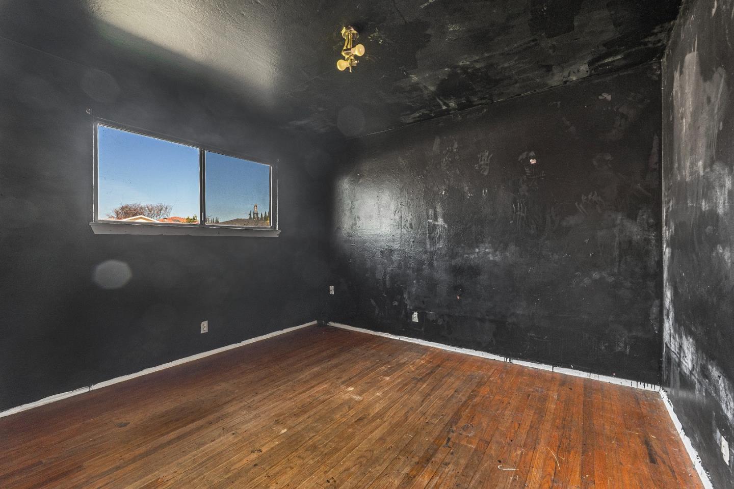 172 Manferd Street Milpitas, CA 95035 - Photo 19 of 45 a view of a room with wooden floor and window