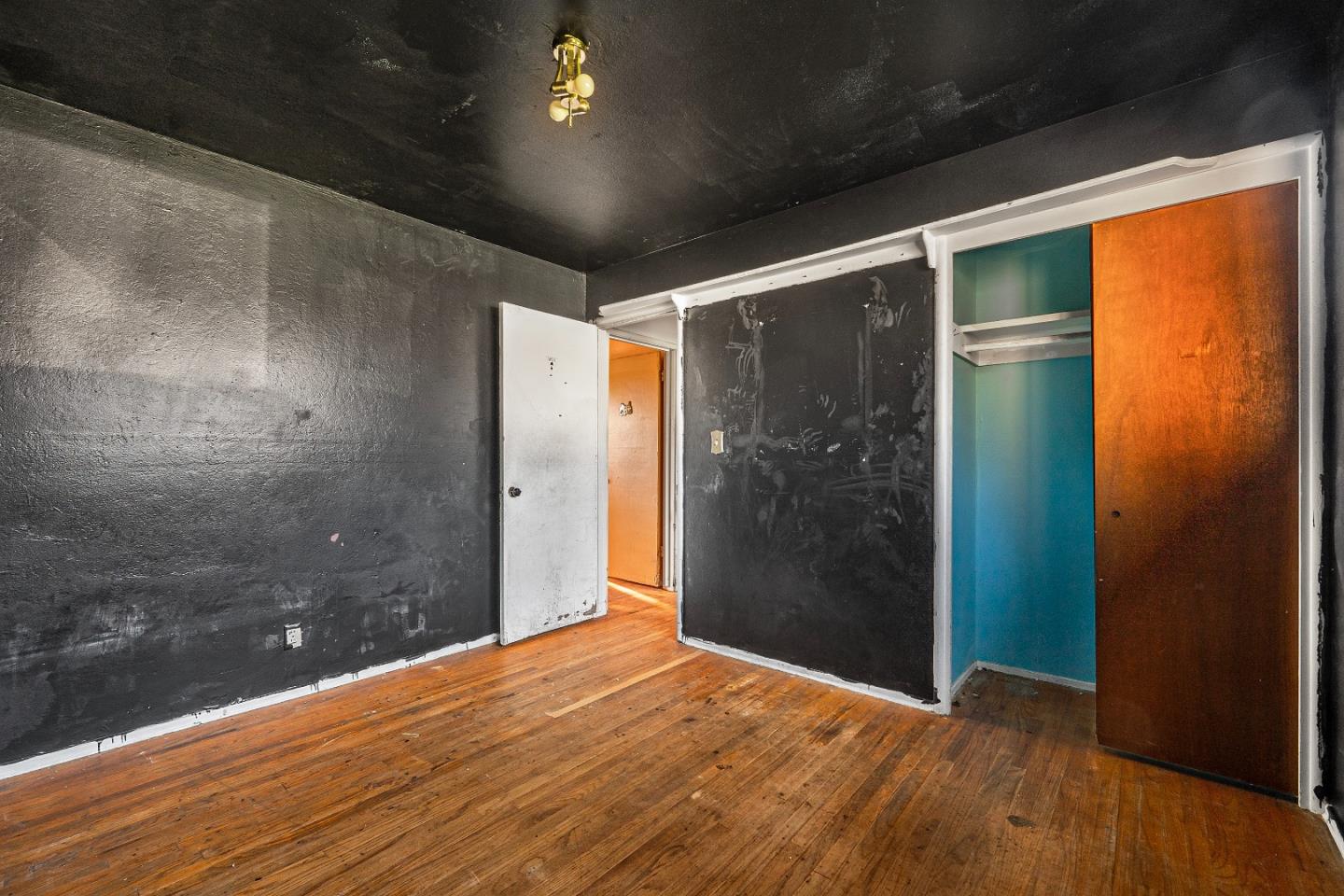 172 Manferd Street Milpitas, CA 95035 - Photo 20 of 45 a view of empty room with wooden floor and door