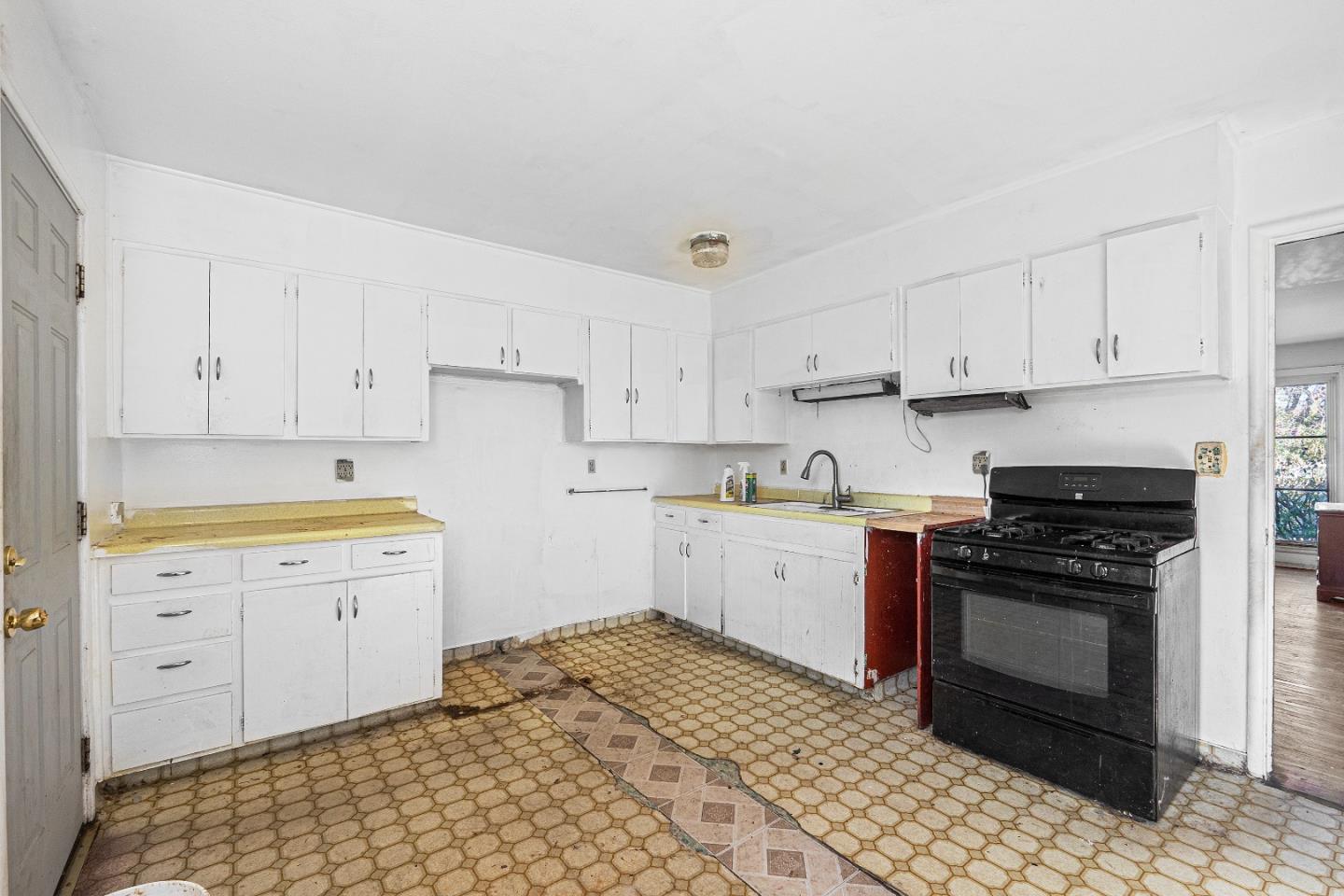 172 Manferd Street Milpitas, CA 95035 - Photo 31 of 45 a kitchen with granite countertop white cabinets and stainless steel appliances