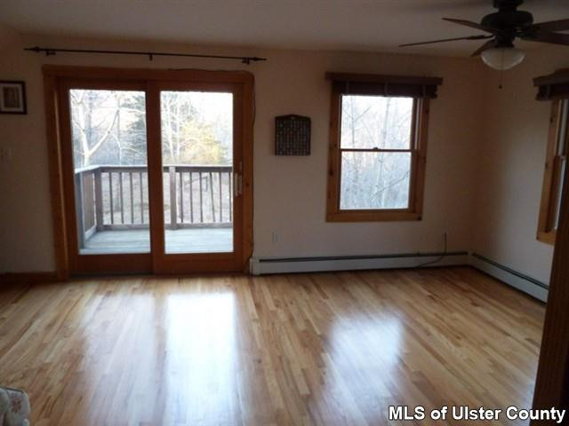 3 Durmo Road New Paltz, NY 12561 - Photo 14 of 17 an empty room with wooden floor and windows