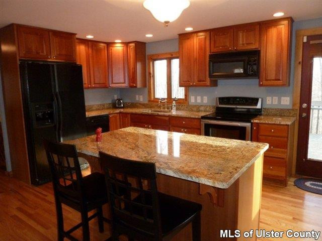 3 Durmo Road New Paltz, NY 12561 - Photo 3 of 17 a kitchen with stainless steel appliances granite countertop a stove refrigerator and microwave