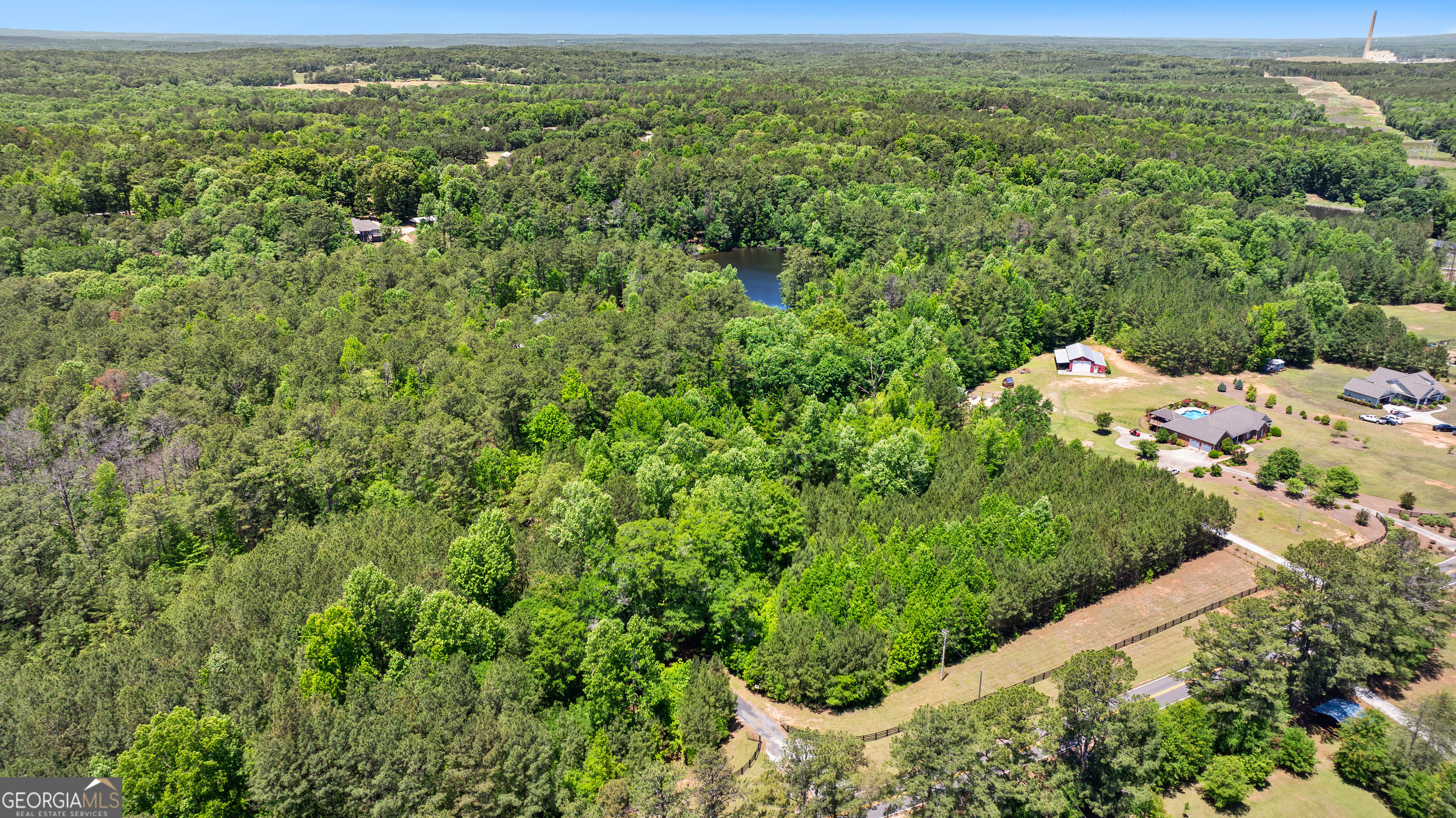 354 Turner Road Newnan, GA 30263 - Photo 78 of 79 a view of a forest with a houses
