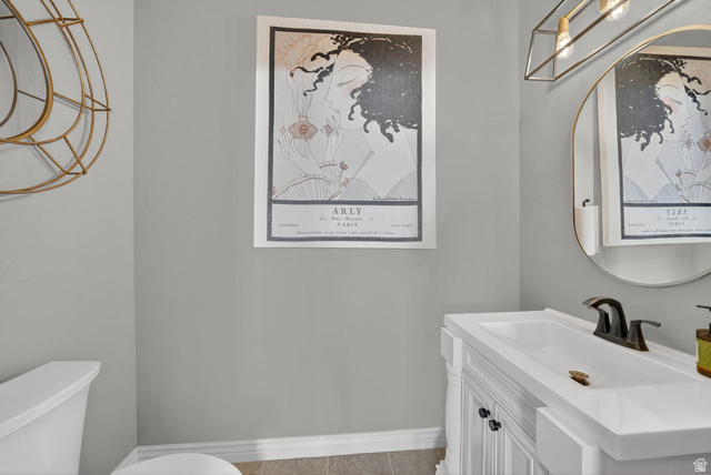 14738 Tangle Hill Road Herriman, UT 84096 - Photo 15 of 66 White vanity with an integrated rectangular sink, bronze-finish faucet, and a contemporary oval mirror