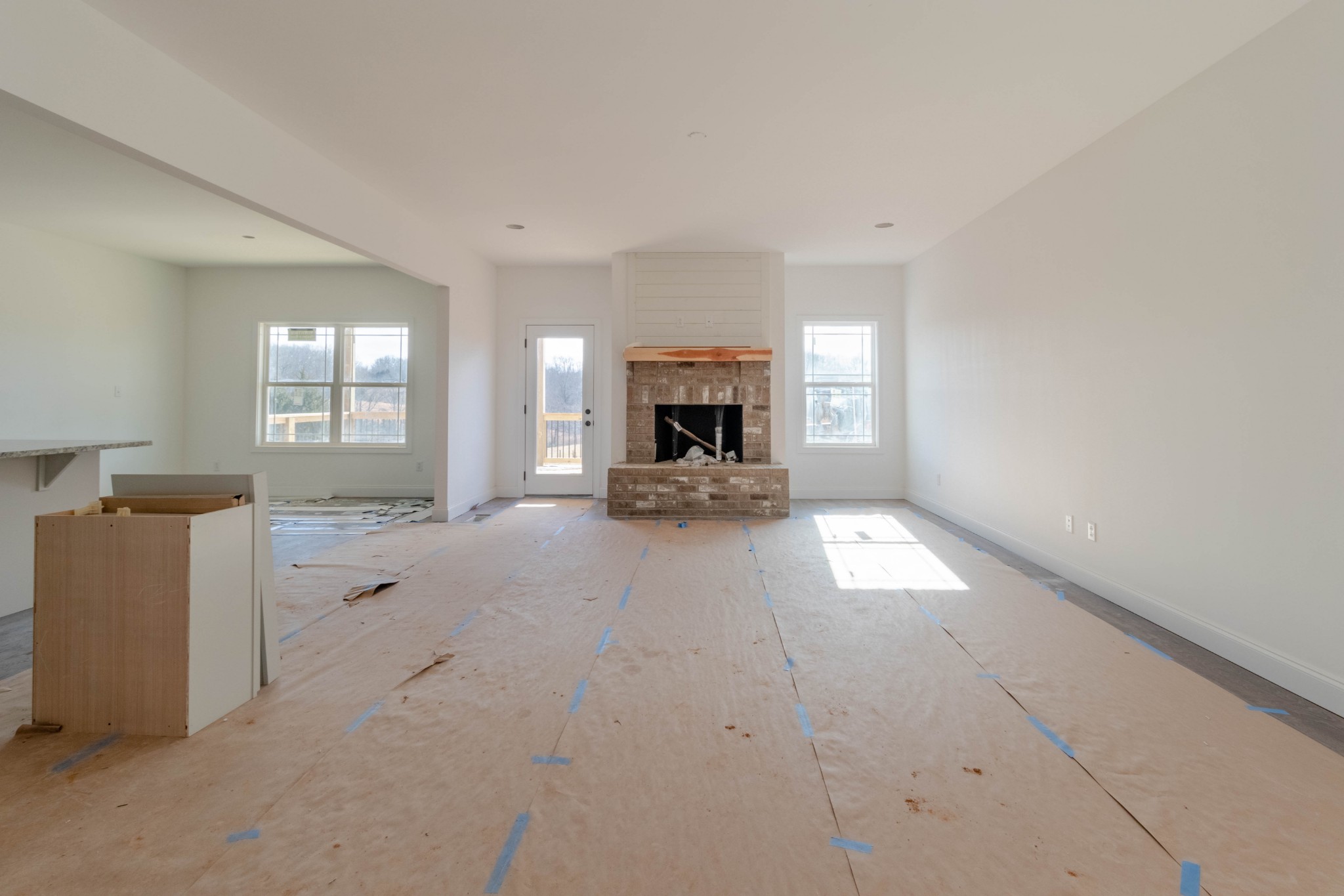 1436 Hickory Point Road Clarksville, TN 37043 - Photo 6 of 22 wooden floor in a room with a window and a fireplace