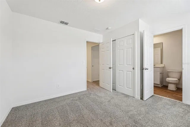 a view of room with windows and bathroom view