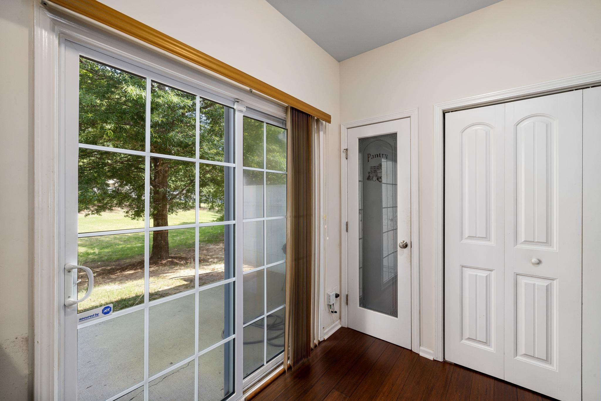 3853 Volkswalk Place Raleigh, NC 27610 - Photo 16 of 19 an empty room with wooden floor and windows