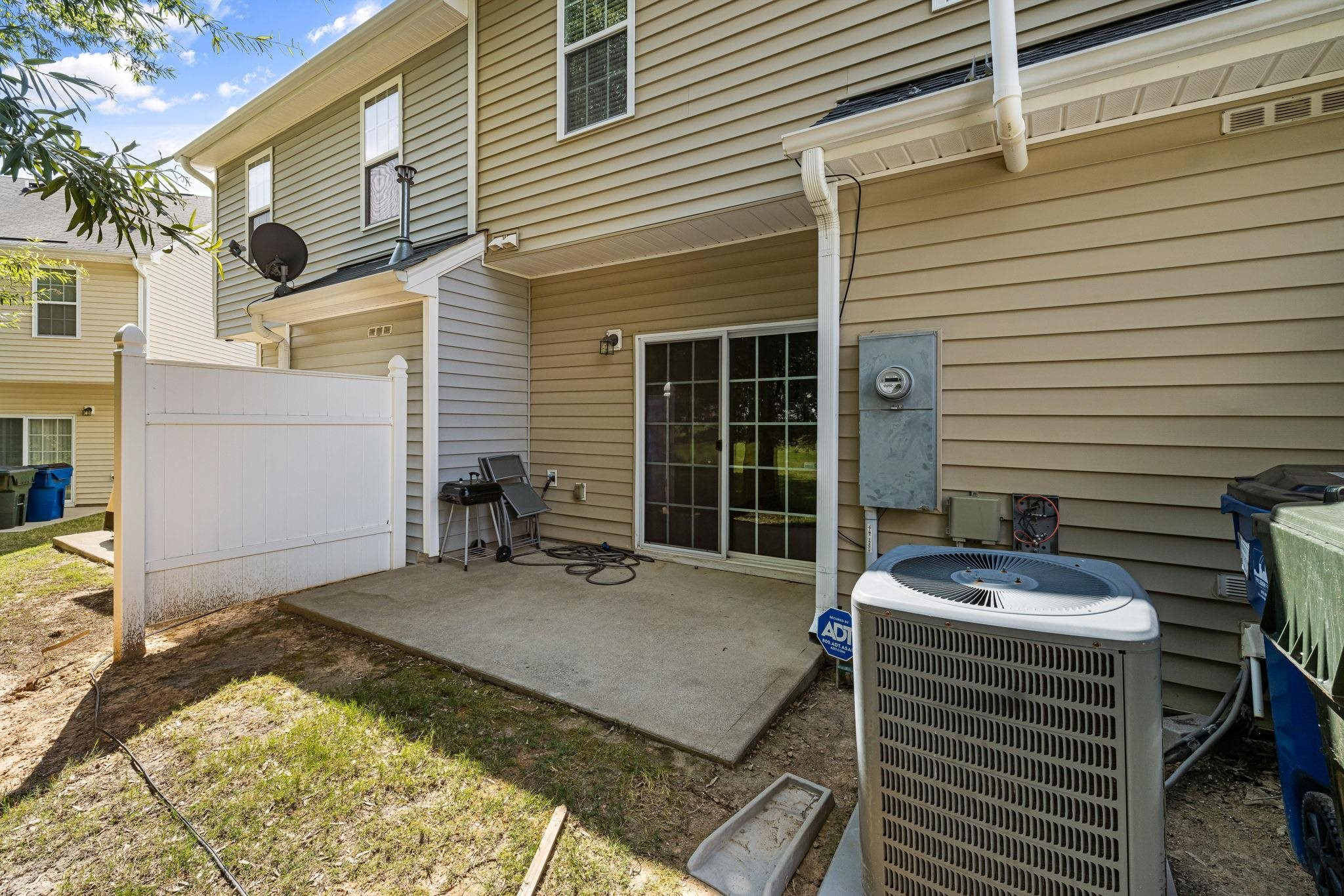 3853 Volkswalk Place Raleigh, NC 27610 - Photo 18 of 19 a backyard of a house with yard and outdoor seating