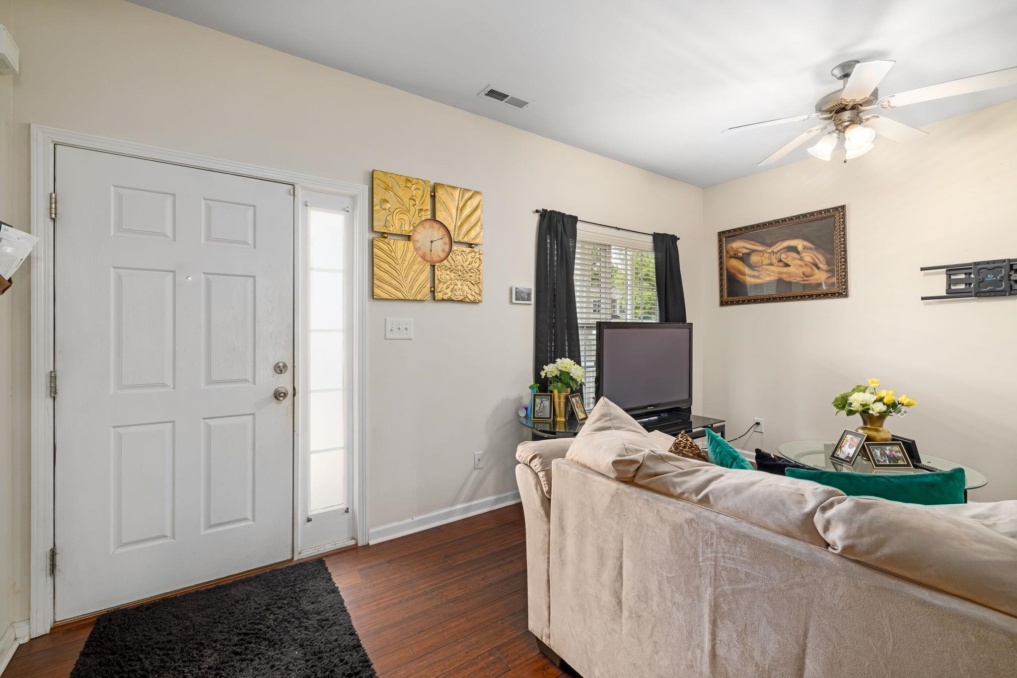 3853 Volkswalk Place Raleigh, NC 27610 - Photo 6 of 19 a living room with furniture and wooden floor