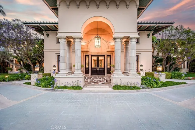 a view of a dining room with furniture wooden floor and chandelier