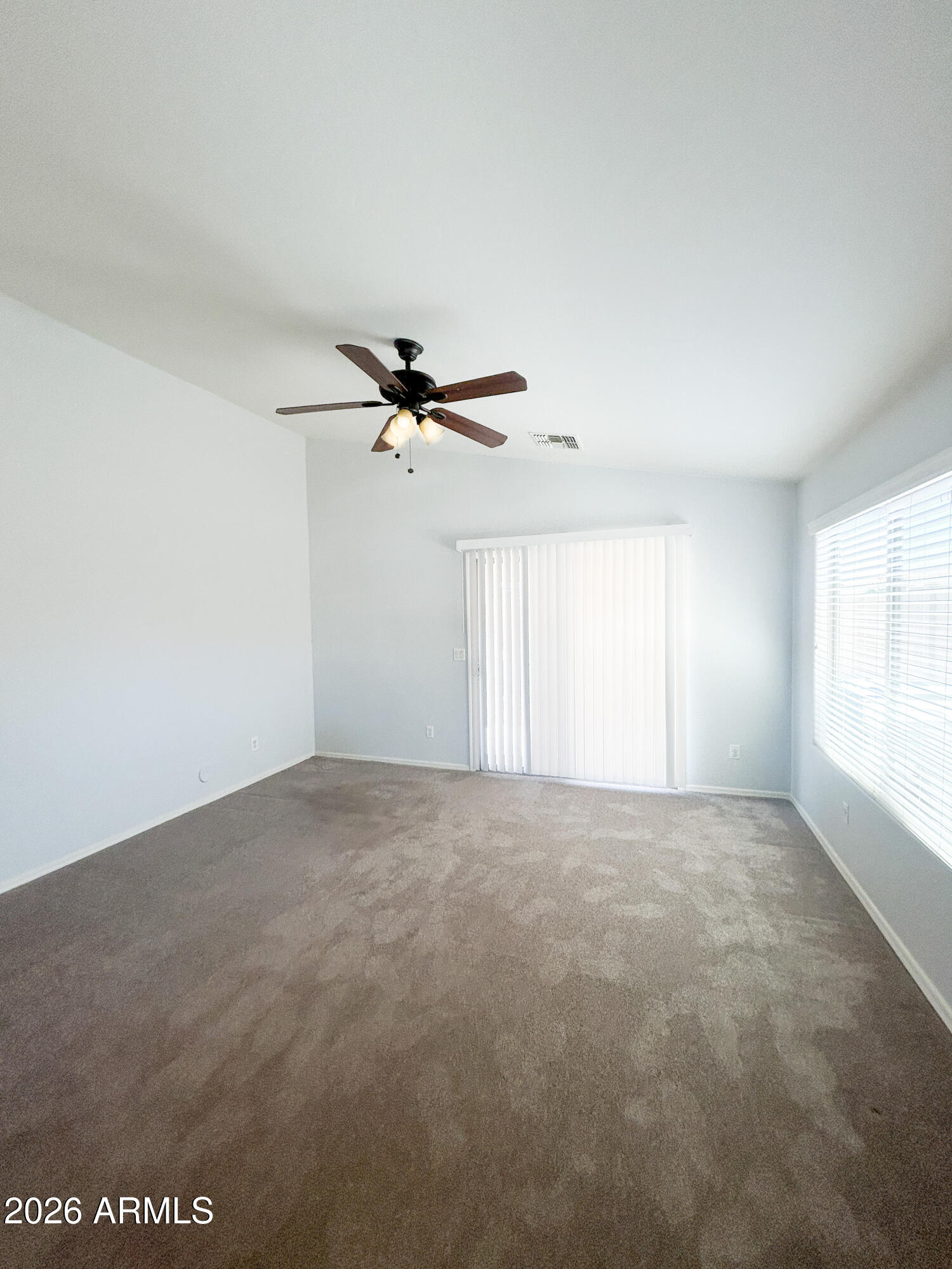 25645 West Dunlap Road Buckeye, AZ 85326 - Photo 11 of 27 a view of an empty room with a window