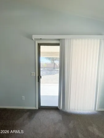 a view of an empty room and window