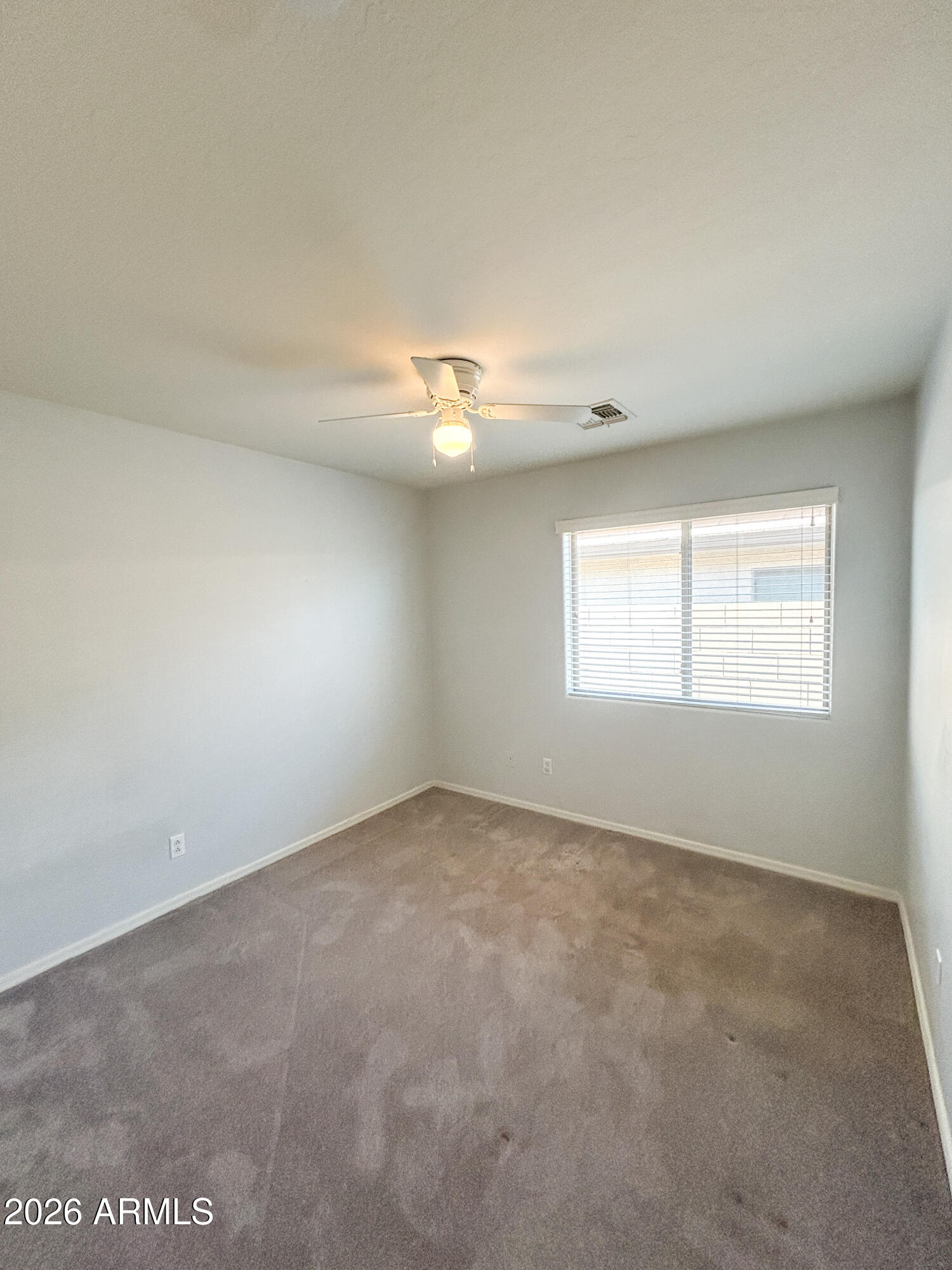 25645 West Dunlap Road Buckeye, AZ 85326 - Photo 13 of 27 an empty room with a window