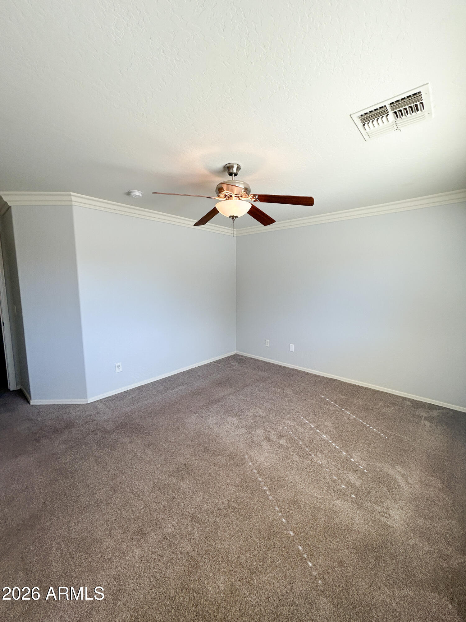 25645 West Dunlap Road Buckeye, AZ 85326 - Photo 19 of 27 a view of a room with racks on the wall