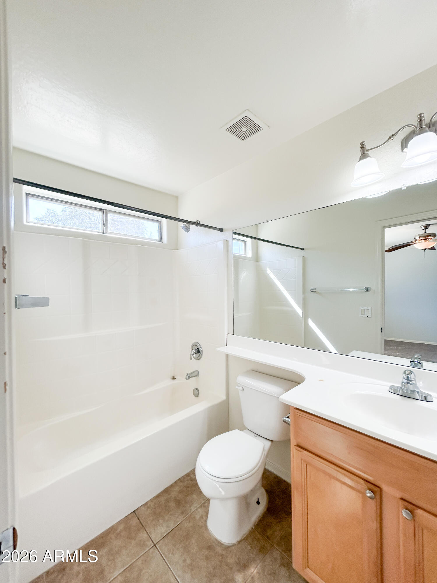 25645 West Dunlap Road Buckeye, AZ 85326 - Photo 24 of 27 a bathroom with a sink mirror vanity and toilet