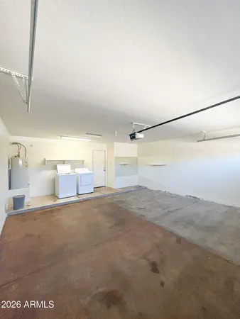 a view of a big room with closet and windows