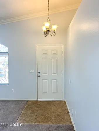 a view of a chandelier in an empty room
