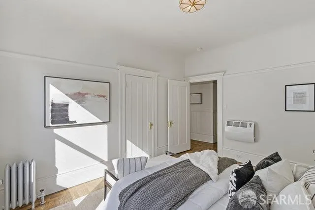 a bathroom with a sink a tub and a potted plant